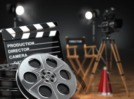 Video, movie, cinema concept. Retro camera, reels, clapperboard and director chair. 3d